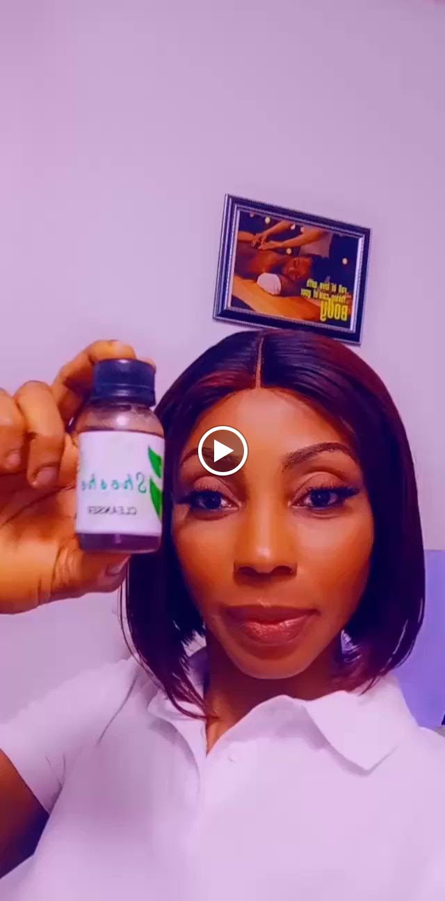 Shosho holding a bottle from the Shosho skincare range