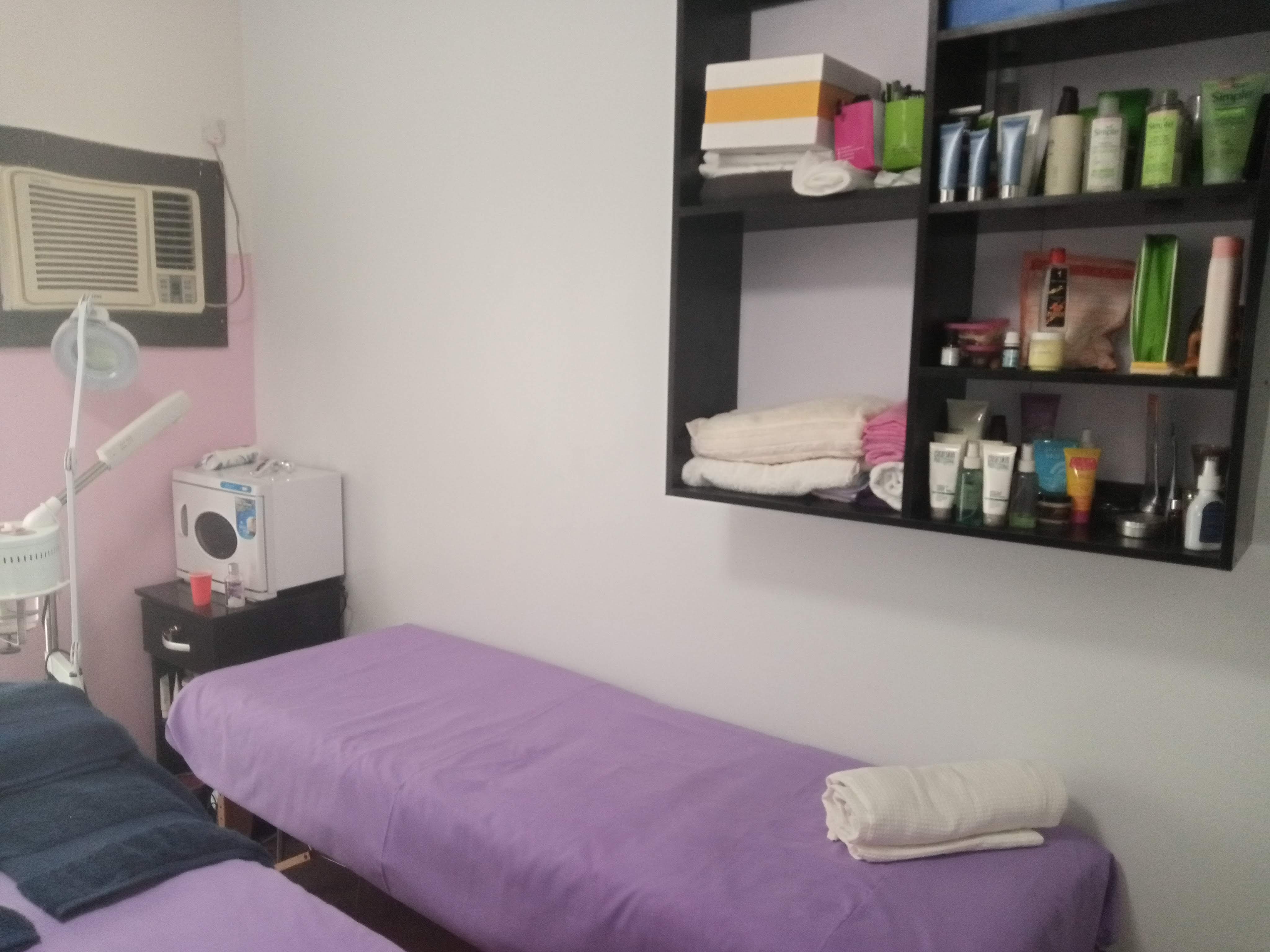 Treatment room with facial equipment and skincare products